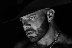 Struggle Jennings in a black cowboy hat, black-and-white portrait